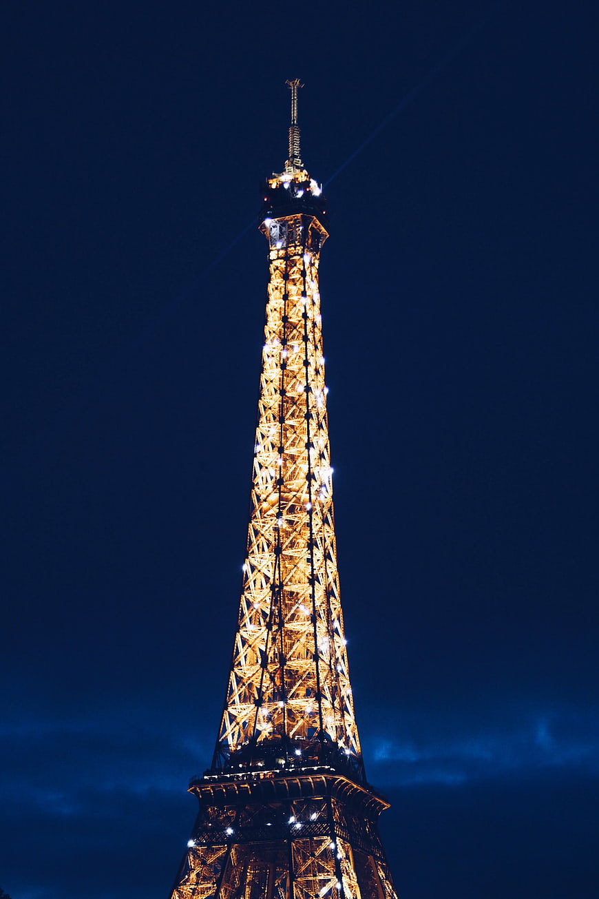 Illuminated Eiffel Tower Against Deep Blue Night Sky