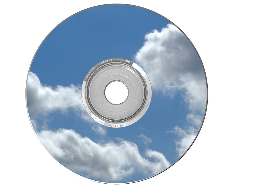CD with blue sky and clouds printed on surface