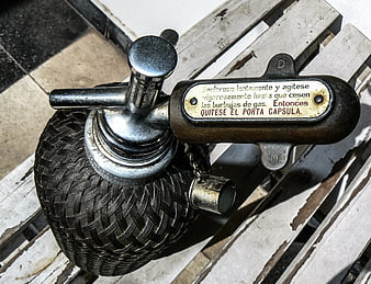 Vintage Siphon Soda Bottle on Wooden Bench