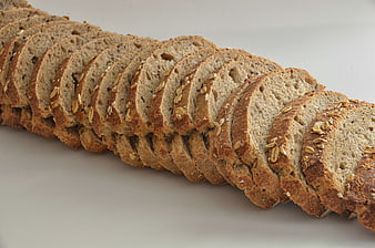 Sliced Whole Wheat Oat Bread on White Background