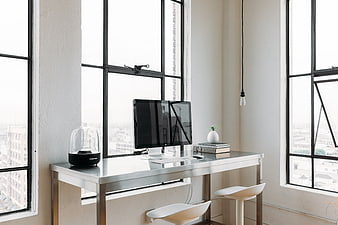 Minimalist Modern Office Desk by Large Industrial Windows