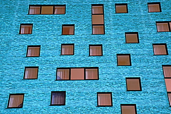 Modern Blue Brick Building Facade with Windows