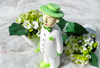 Green and White Wooden Groom Figurine with Flowers
