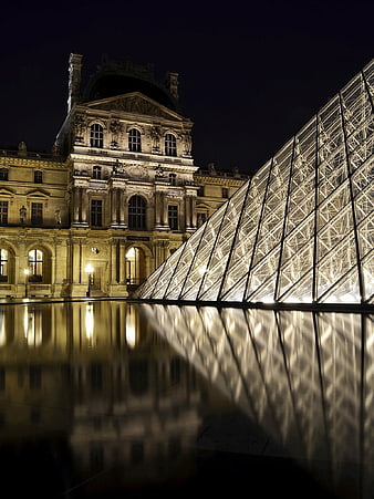 Louvre Museum Pyramid and Facade at Night with Water Reflection