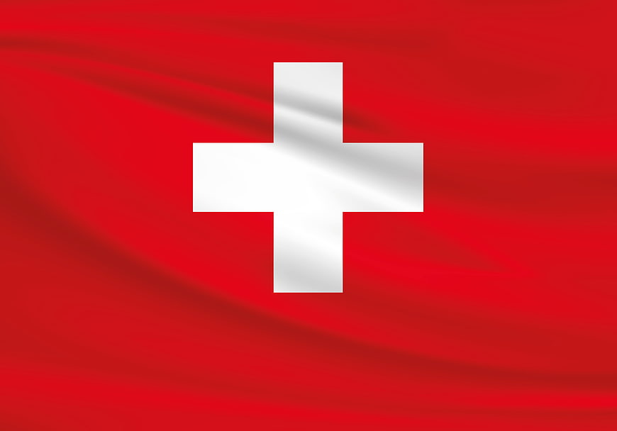 Swiss flag waving in the wind with white cross on red background