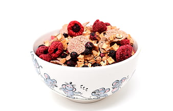 White Bowl With Cartoon Mice Filled With Muesli And Dried Raspberries