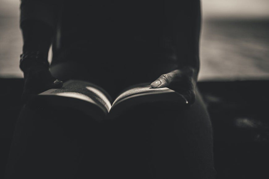 Woman Reading Book in Black and White