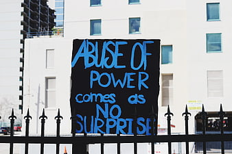 Protest Sign Reading Abuse of Power Comes as No Surprise