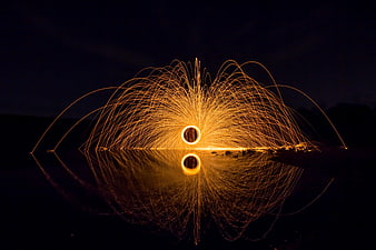 Steel Wool Light Painting with Reflection in Water at Night