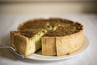 Homemade Quiche Lorraine with Herbs on White Plate