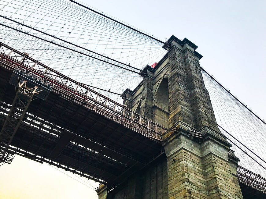 Low Angle View of Brooklyn Bridge Stone Tower and Cables
