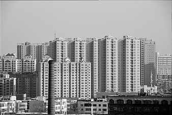 Black and white cityscape of modern apartment buildings