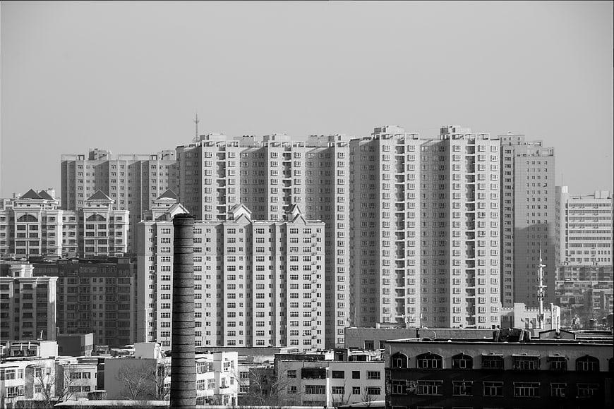 Black and white cityscape of modern apartment buildings