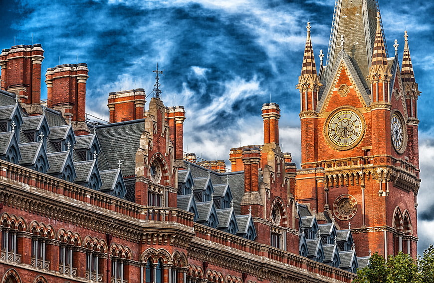Stunning Red Brick Gothic Architecture with Clock Tower and Blue Sky