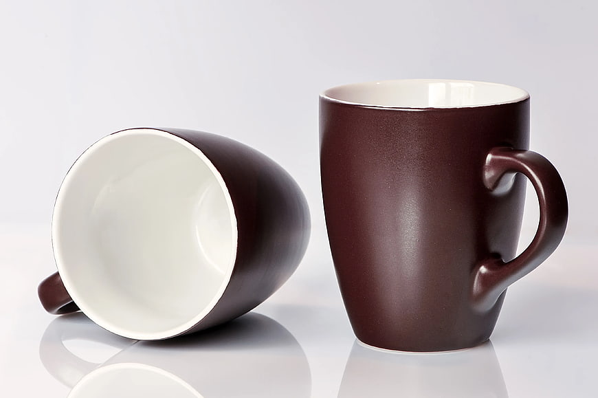Two Brown Ceramic Mugs on White Background