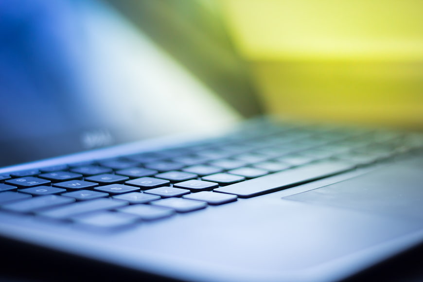 Close-up of laptop keyboard with blurred background