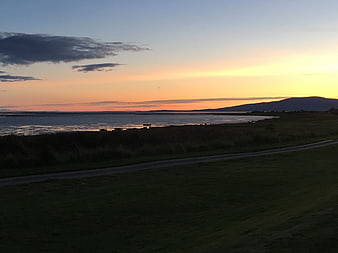 Scenic Sunset Over Scottish Water Landscape With Distant Hills