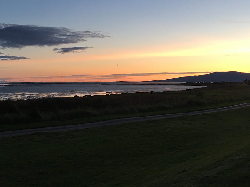 Scenic Sunset Over Scottish Water Landscape With Distant Hills