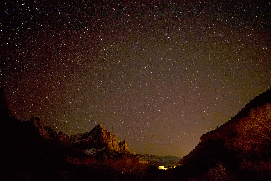 Starry Night Sky Over Mountain Landscape
