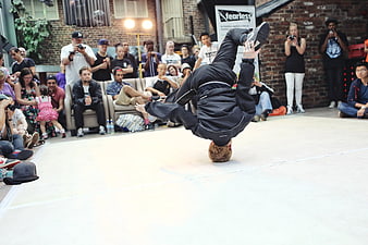 Breakdancer performing headspin at urban street dance competition