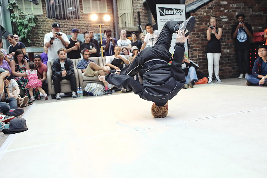 Breakdancer performing headspin at urban street dance competition