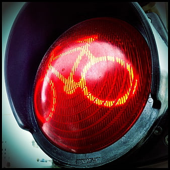 Close-up of Red Traffic Light Signal with Reflections