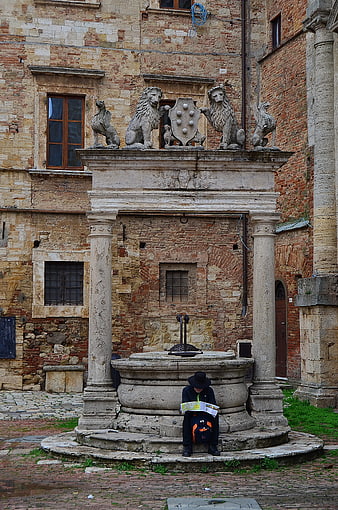 Tourist Reading Map at Historic Stone Fountain