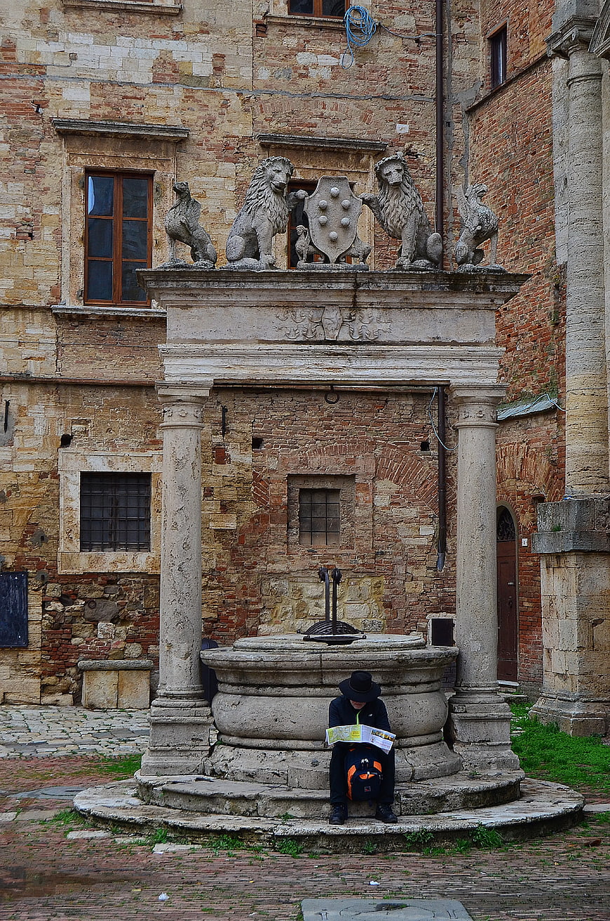 Tourist Reading Map at Historic Stone Fountain