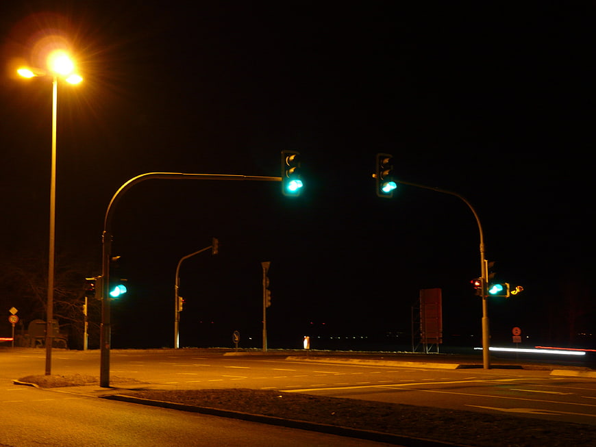 Green Traffic Lights at Night Intersection