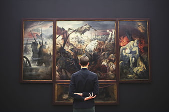 Man Viewing War Triptych in Art Gallery