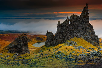 Dramatic Old Man of Storr rock formation at sunrise