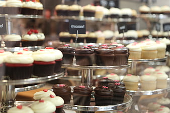 Assorted chocolate and vanilla cupcakes on tiered display