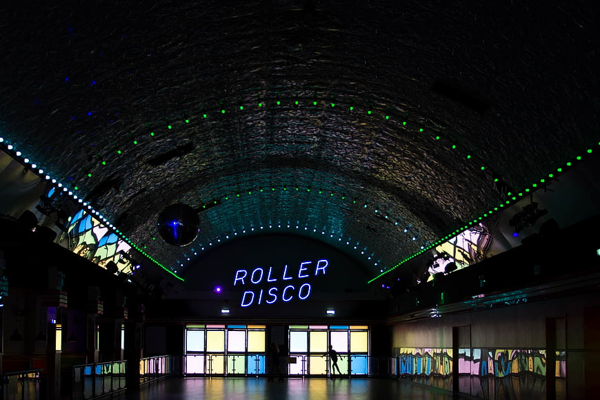 Neon Roller Disco Sign in Arched Brick Hall