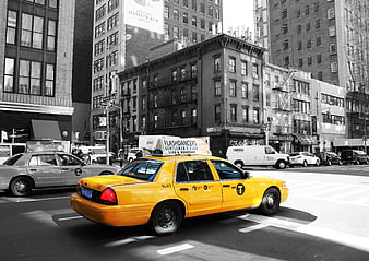 Yellow NYC Taxi in Black and White City Street