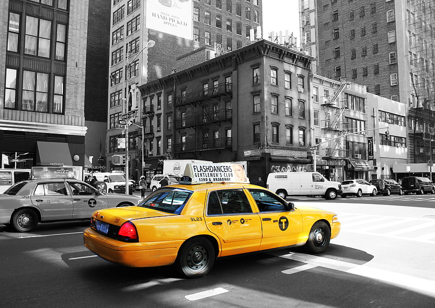 Yellow NYC Taxi in Black and White City Street