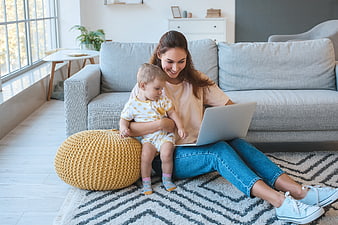 Mother and Toddler Using Laptop at Home