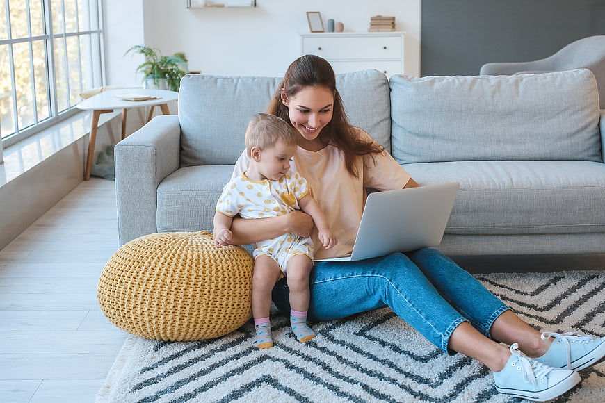Mother and Toddler Using Laptop at Home