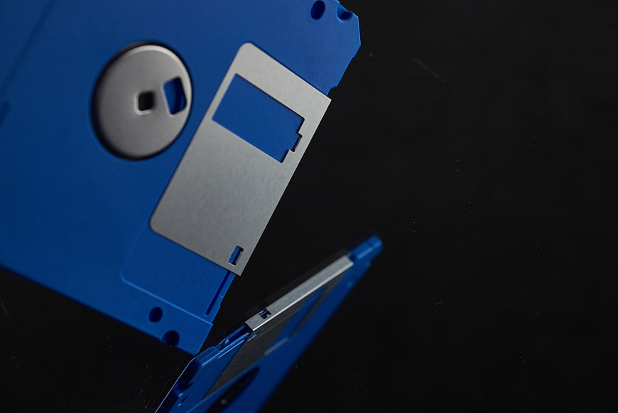 Blue Floppy Disk on Black Background