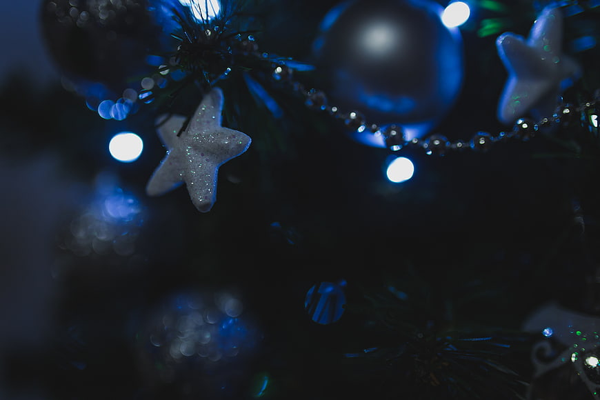 Close-up of Glittering Star Ornament on Christmas Tree