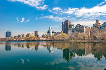 New York City skyline reflection in Central Park reservoir spring