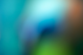 Abstract Blurred Gradient Background with Blue, Green, and Orange Hues
