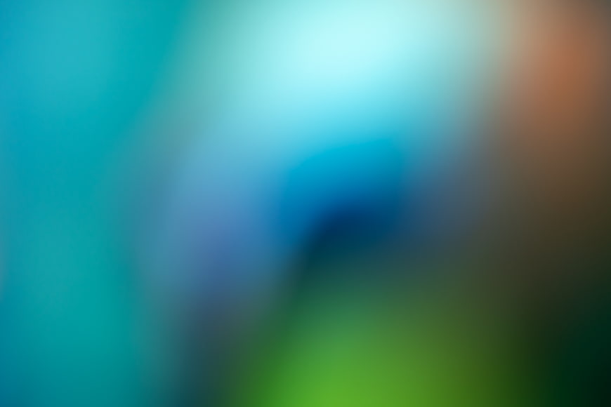 Abstract Blurred Gradient Background with Blue, Green, and Orange Hues