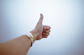 Hand Giving Thumbs Up Gesture Against Sky