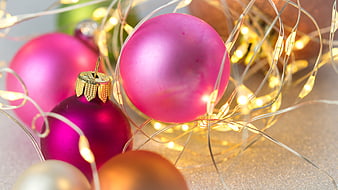 Pink and Magenta Christmas Ornaments With Warm Fairy Lights
