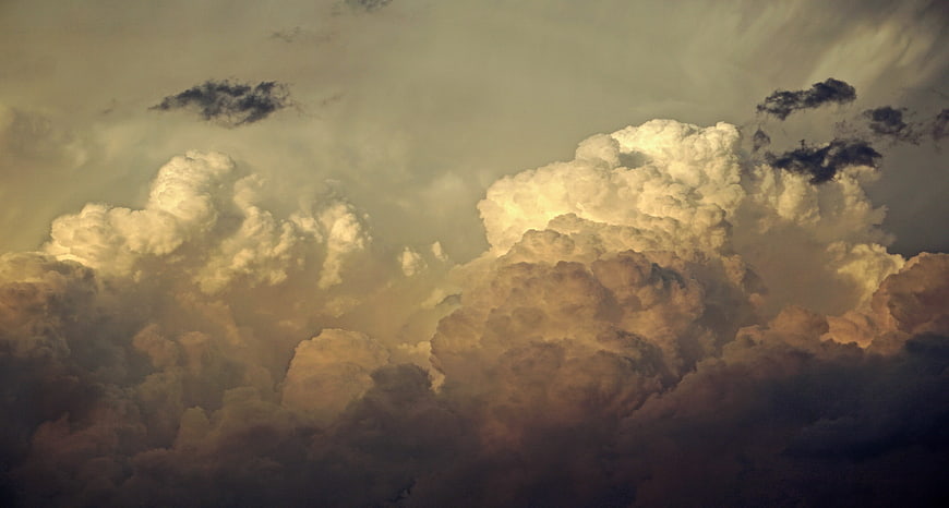 Dramatic Golden Hour Storm Clouds with Dark Shadows