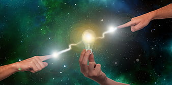 Conceptual teamwork image with hands creating a glowing lightbulb idea