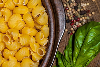 Raw Conchiglie Pasta with Basil and Peppercorns