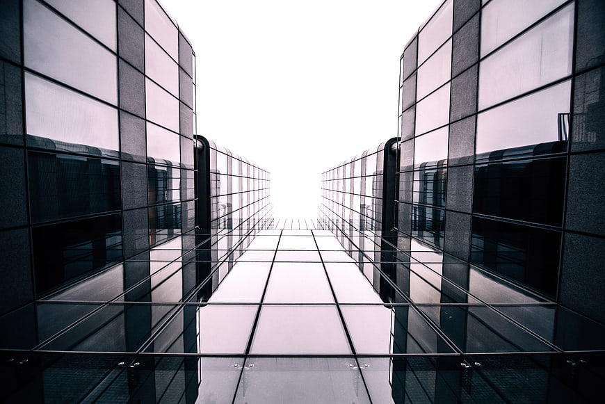 Symmetrical modern glass architecture with leading lines