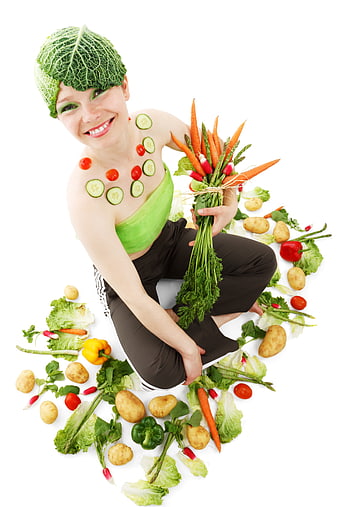 Woman with vegetable makeup holding fresh produce bouquet