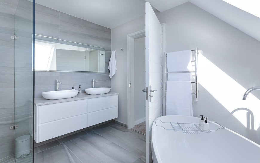 Modern Minimalist Bathroom Interior With Double Vanity And Freestanding Bathtub